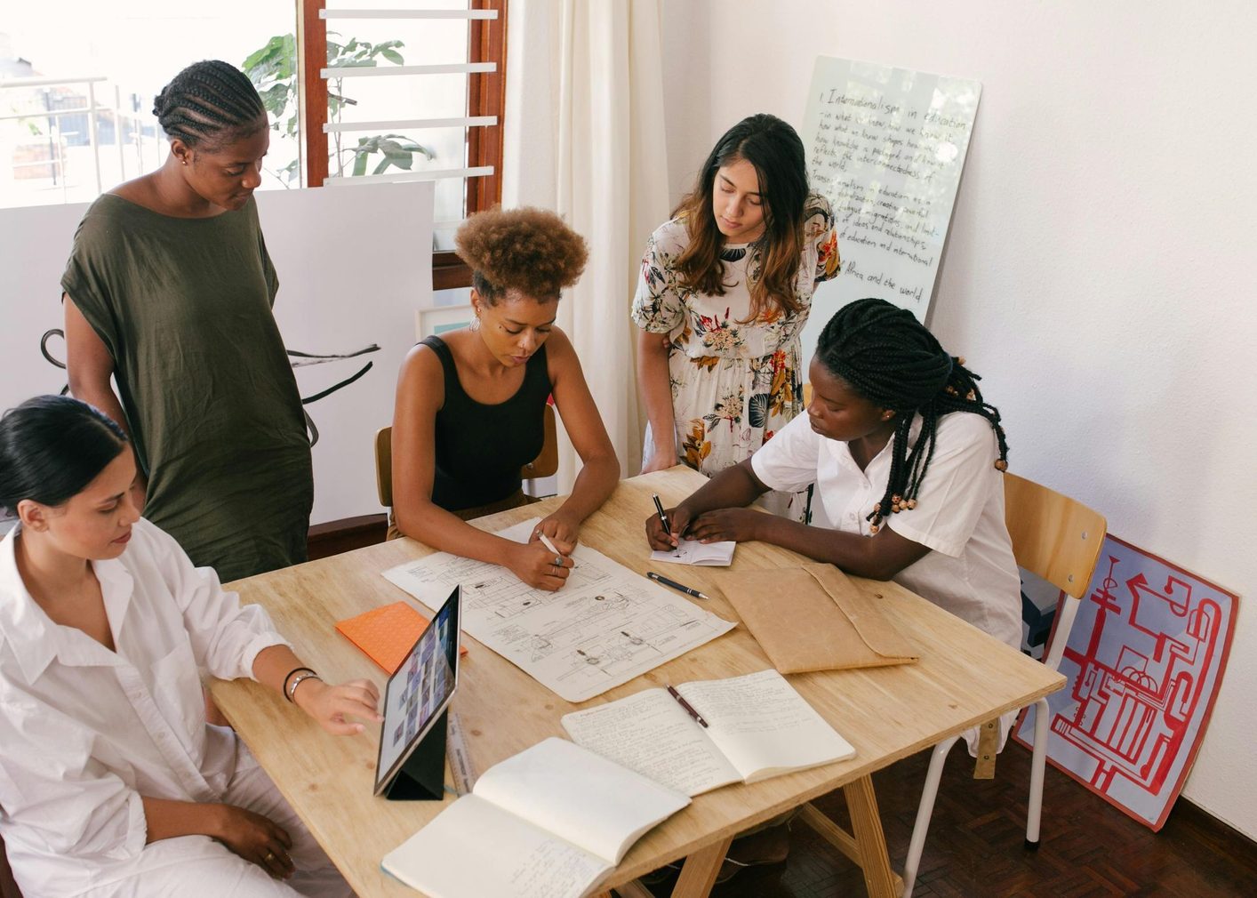 A community team working together around a table